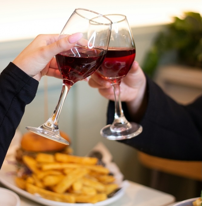 two people doing a cheers